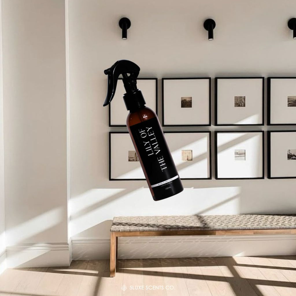 Spray bottle with 'Day of the Dead' label on a wall with framed pictures