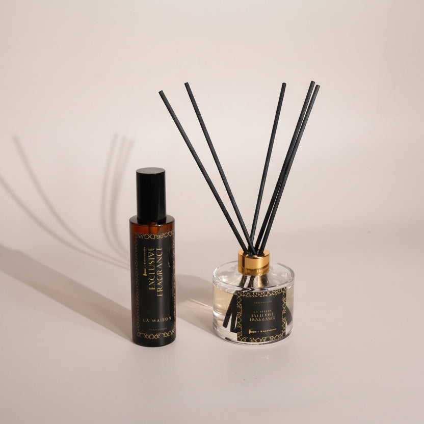 Diffuser bottle with reeds on a light gray background