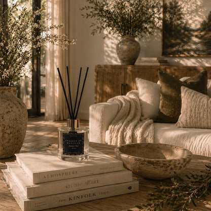 Living room with a couch, books, and decorative items on a coffee table.
